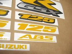 Reflective yellow emblems for Suzuki GSXR 125